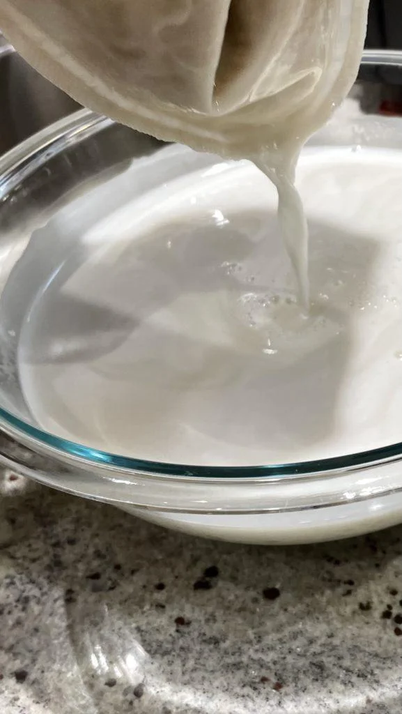 oat milk through nut milk bag