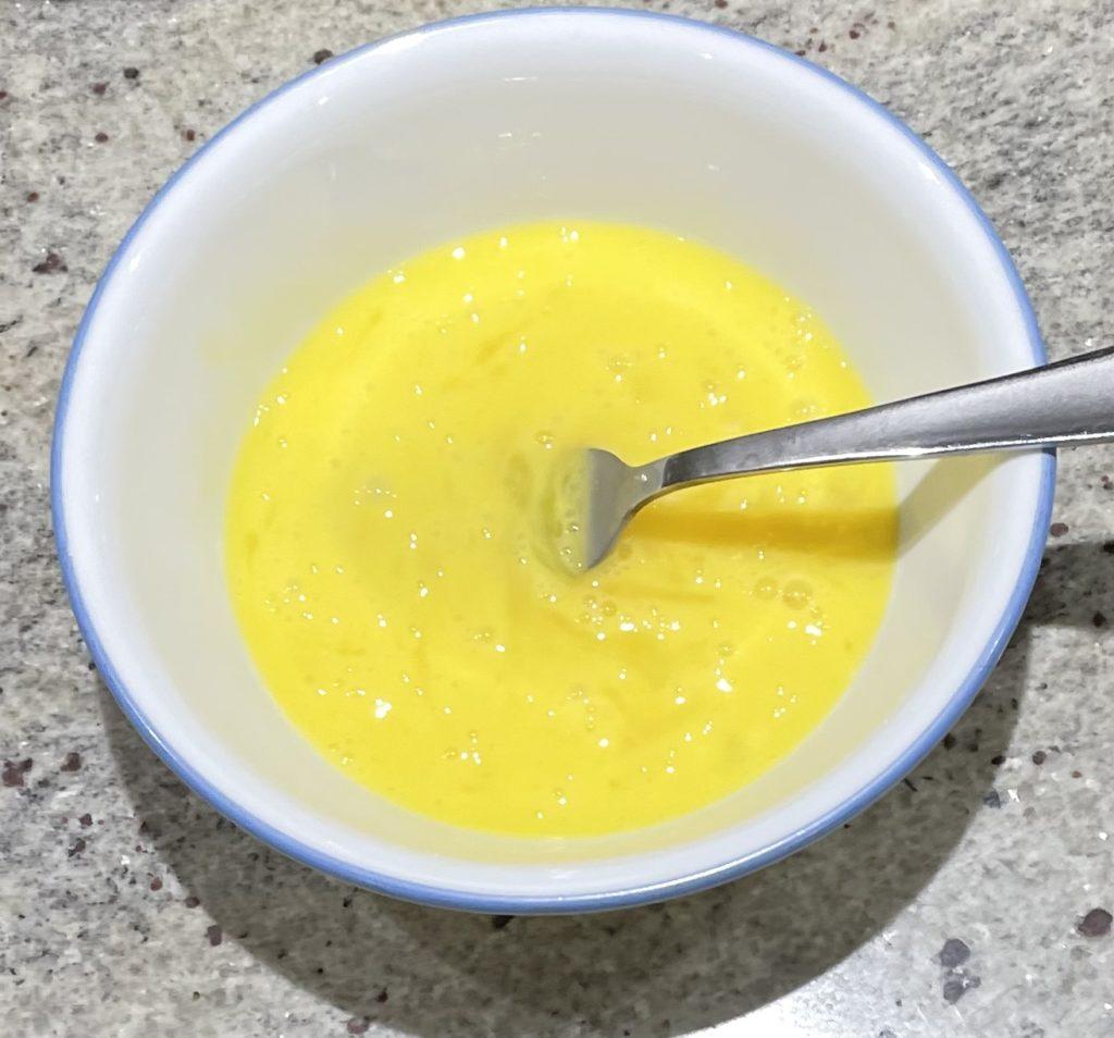 whisked eggs in a bowl