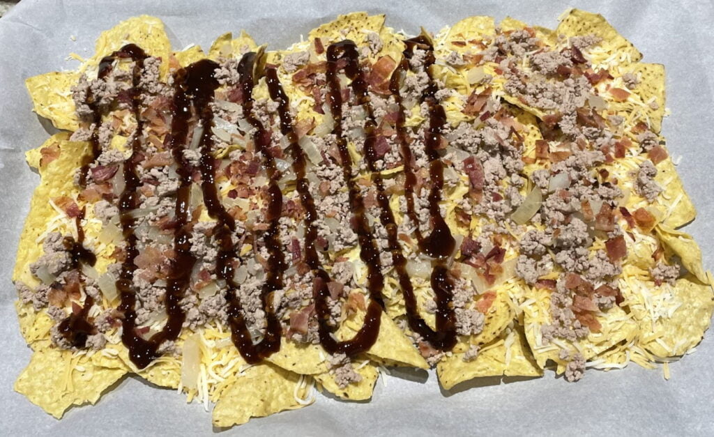 chips, cheese, meat, bacon, and bbq sauce